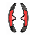 Porsche SportDesign-Schaltwippen aus schwarzem Carbon – Paar mit roter Schutzfolie auf den Klebepads